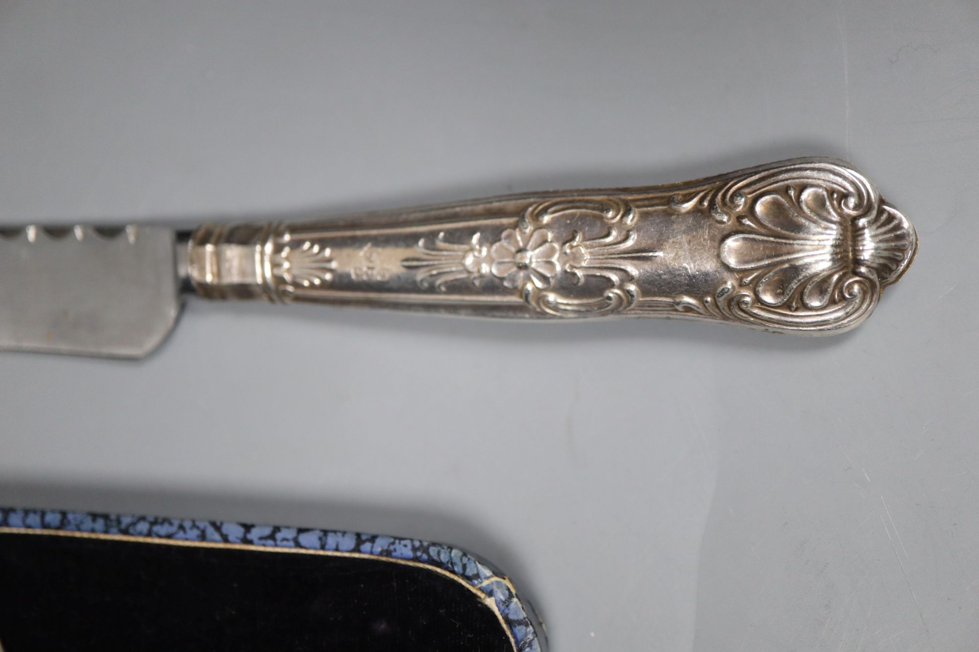 An 830s pastry tongs, a knife, a cased set of six bean end coffee spoons and an infuser.
